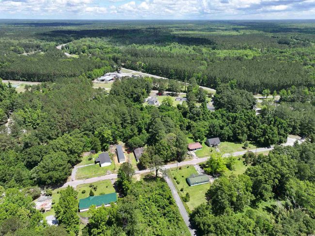 Birds eye view of property featuring a forest view | Image 13
