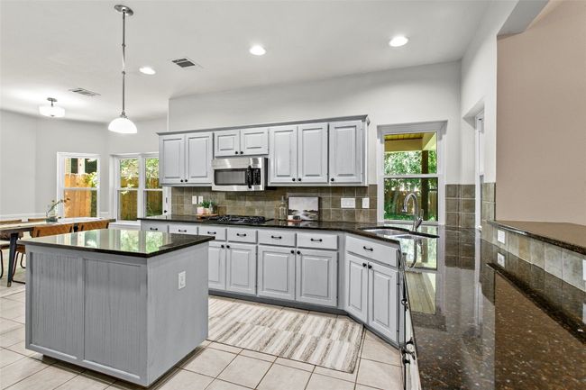 Large kitchen with double ovens, island and breakfast bar | Image 15