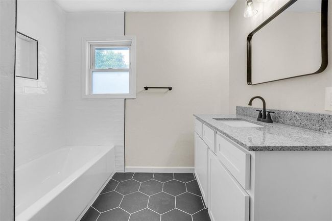 Bathroom featuring vanity and tile patterned floors | Image 31
