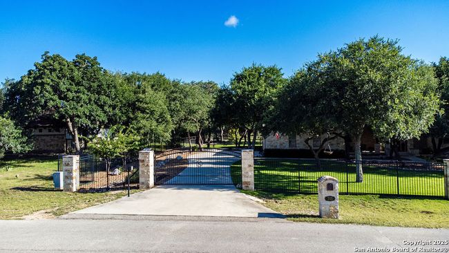 Stone &amp; iron fence with electric gate &amp; key pad | Image 5