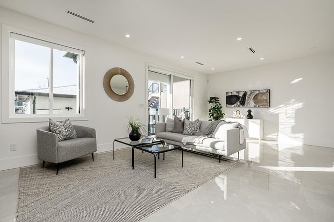 Living area featuring baseboards, recessed lighting, and marble tiled flooring | Image 8