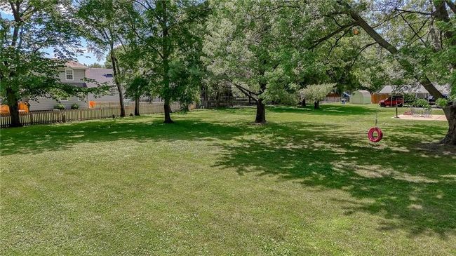 View of yard with a storage shed | Image 47