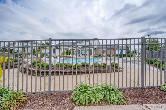 Gate featuring a community pool | Image 31