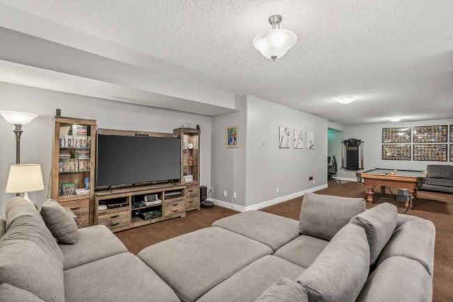 425 Boulder Creek Way Se, Home with 4 bedrooms, 3 bathrooms and 6 parking in Langdon AB | Image 33
