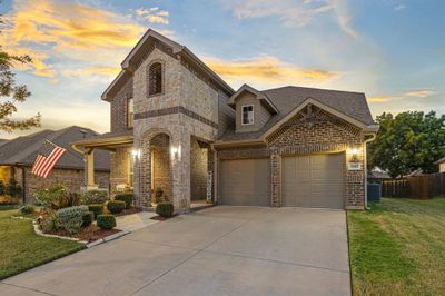 View of front of house featuring a yard and a garage | Image 1