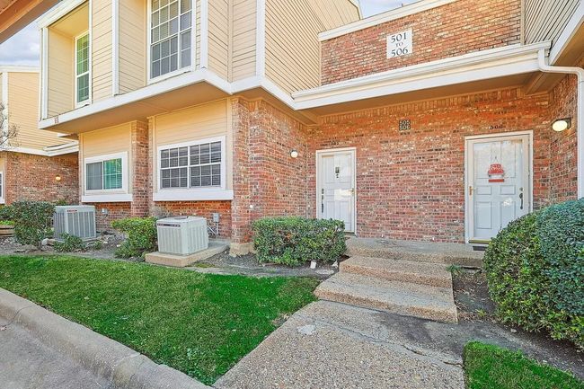 Doorway to property featuring brick siding and central AC | Image 17