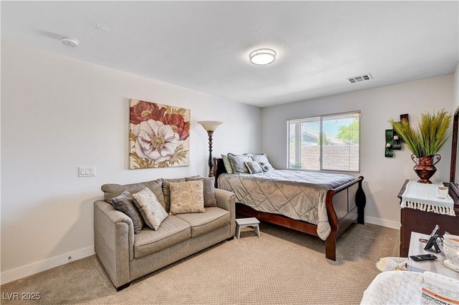 Bedroom featuring light colored carpet and baseboards | Image 19
