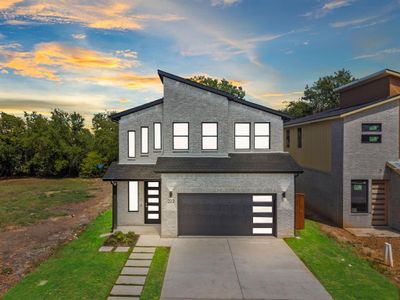 View of front of house featuring a garage | Image 1