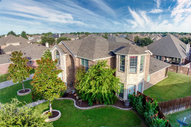 View of front facade featuring brick siding, a residential view, stone siding, and roof with shingles | Image 37