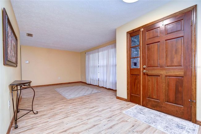Kitchen with pass through window to patio | Image 32