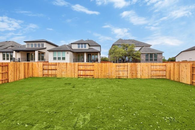 View of fenced backyard | Image 23