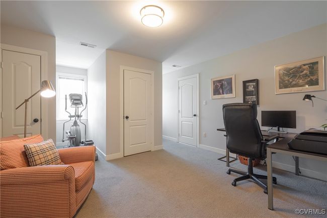 Office area featuring light colored carpet, baseboards, and visible vents | Image 27