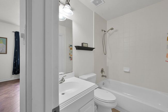The upstairs ensuite full bathroom works perfect for the upstairs guest room. | Image 32