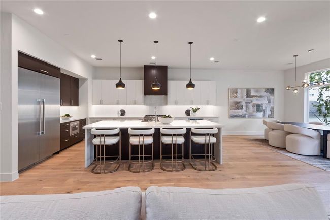 Kitchen area with dining room to the right | Image 10