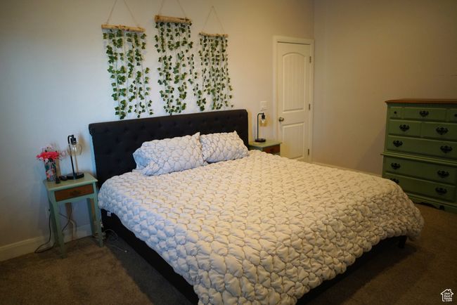Carpeted bedroom with baseboards | Image 23