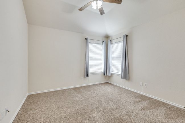 Carpeted empty room with baseboards and ceiling fan | Image 21