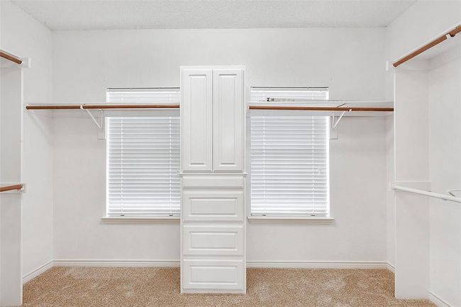 Walk in closet featuring carpet | Image 18