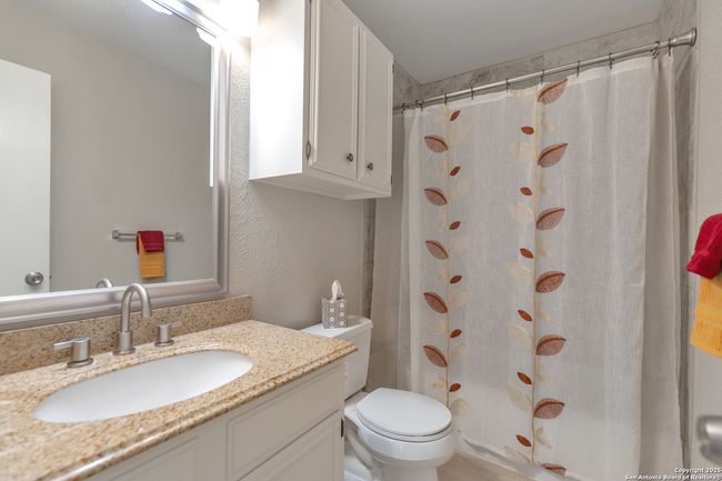 Hall bathroom with bathtub/shower combo. | Image 22