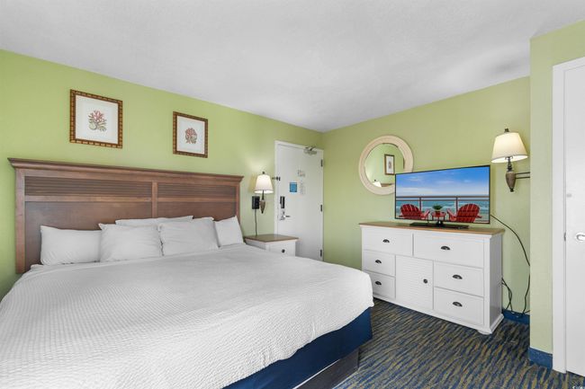 Bedroom with dark colored carpet | Image 19