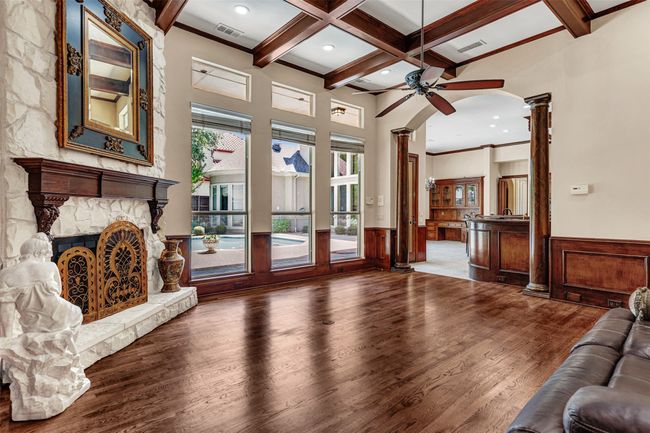 You will fall in love with the attention to detail in every room, such as these columns adorning the arched doorway from the family room to the kitchen. | Image 19