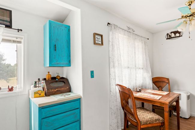 Dining room featuring Separate apartment above garage - wood finished floors and ceiling fan | Image 72
