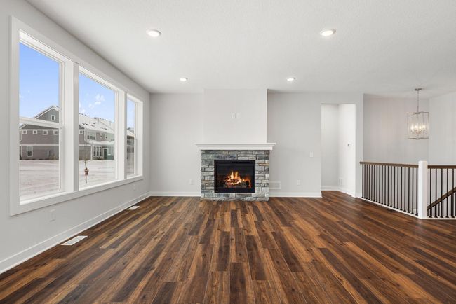 The living room’s open layout, large sun-filled windows, and cozy ambiance make it the perfect space to relax, entertain, or enjoy time with loved ones. | Image 9
