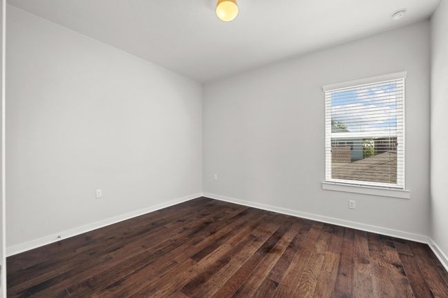Each guest bedroom is spacious and filled with natural light, offering comfort and privacy for visitors or family members alike | Image 30