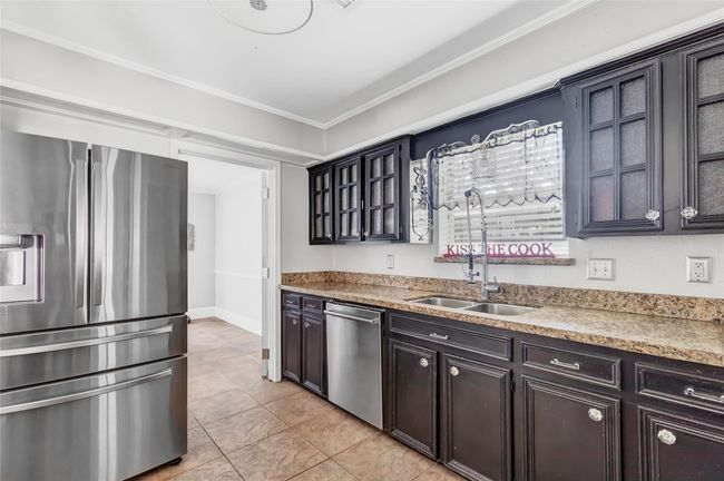 Kitchen leads to formal dining | Image 25