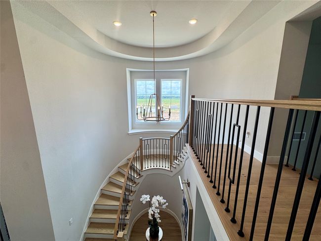 Stairway featuring a chandelier, recessed lighting, and wood finished floors | Image 30