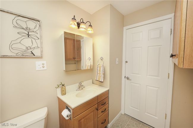 Bathroom featuring toilet and vanity | Image 26