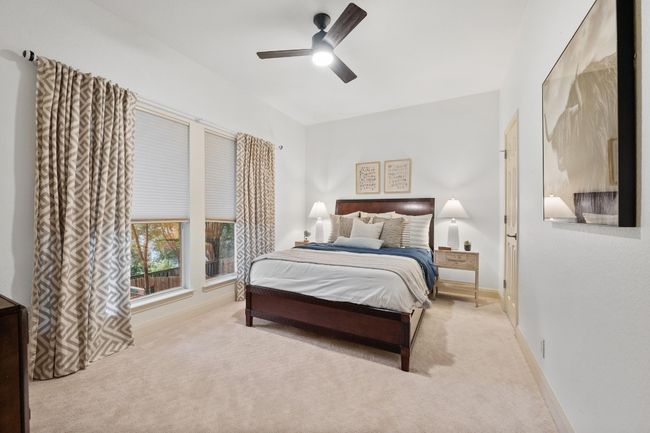 Carpeted bedroom with baseboards and a ceiling fan | Image 21