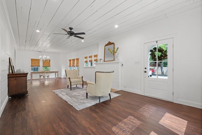 Living room featuring a chandelier, wood finished floors, recessed lighting, ceiling fan, and wood ceiling | Image 4