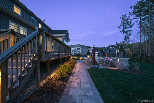 Yard at dusk with a wooden deck and a patio area | Image 44