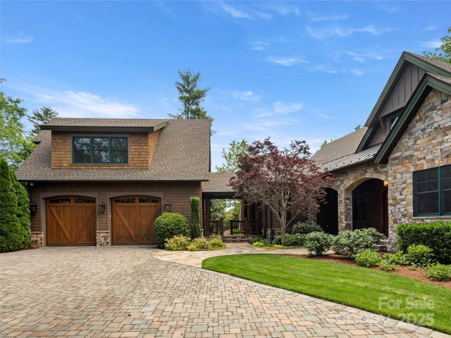 Oversized two-car garage connected to house through breezeway. Private 4th ensuite bedroom is above the garage, can also be used as an executive office. | Image 4