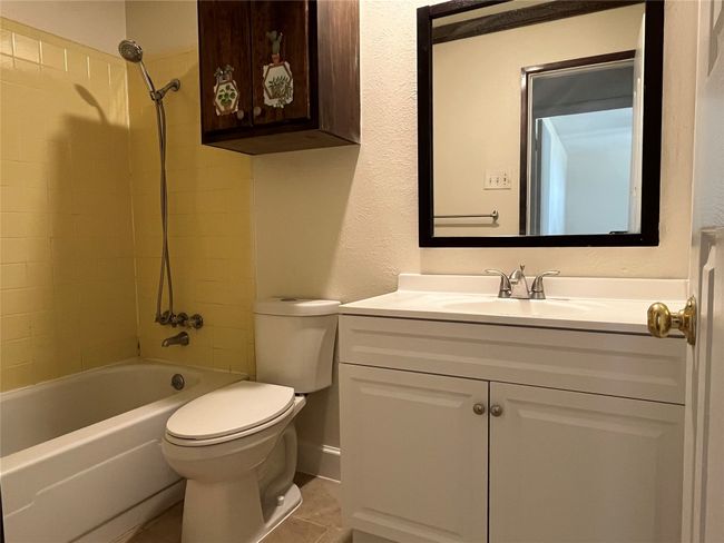 Full bathroom with toilet, vanity, bathing tub / shower combination, and tile patterned flooring | Image 19