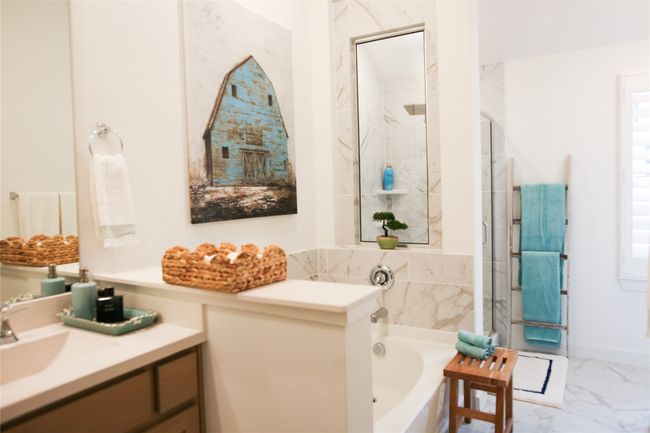 Full bath featuring vanity, a bath, marble look tile flooring, and a shower with door | Image 29
