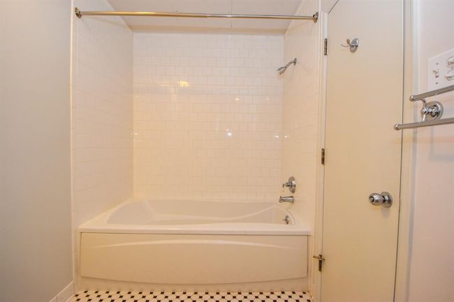The primary bathroom soaking tub alongside a separate shower. | Image 29