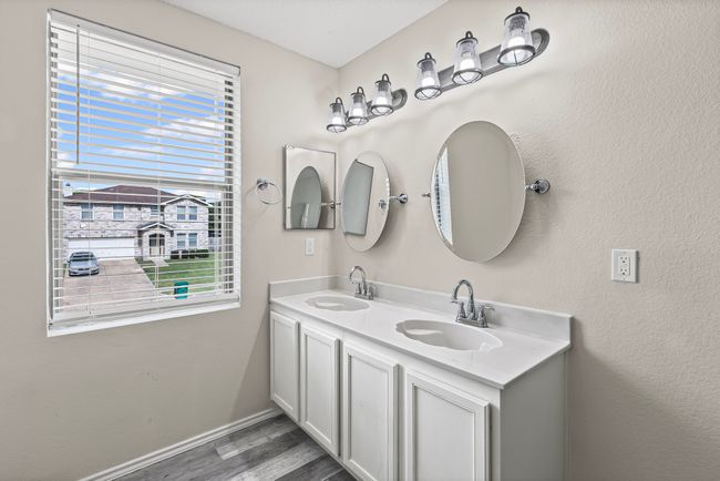 Full bathroom with wood finished floors and double vanity | Image 14