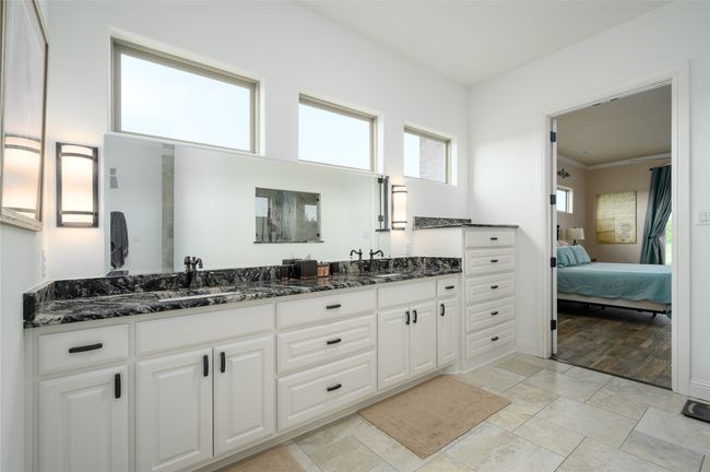 Bathroom with double vanity, and double sink. | Image 19