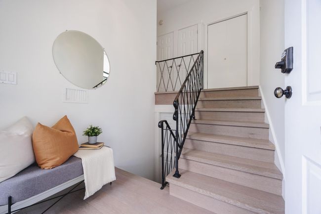 Stairs featuring wood finished floors | Image 14