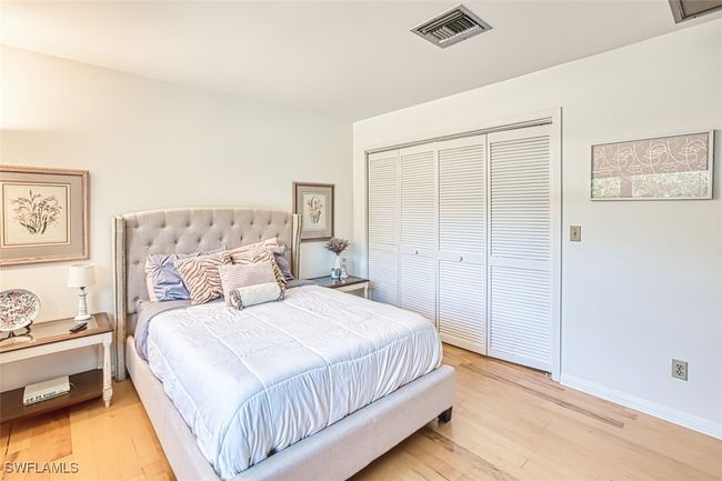 Bedroom featuring light wood-style floors and a closet | Image 25