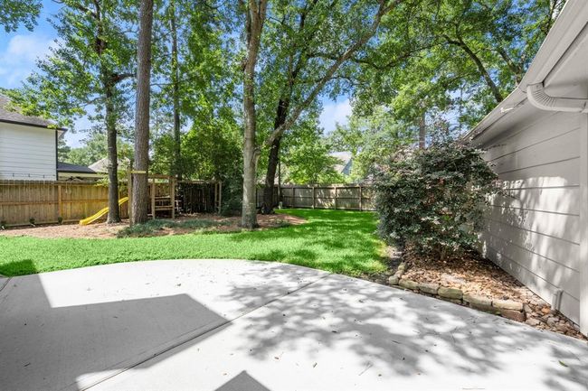 A large patio provides the ideal spot for BBQs and outdoor furniture, perfect for gatherings and enjoying the view. | Image 38