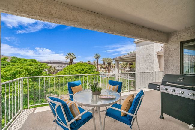 View of patio featuring a balcony and grilling area | Image 6