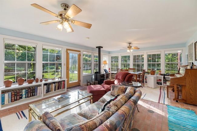The second living/entertainment room looks directly out to the English gardens. | Image 30