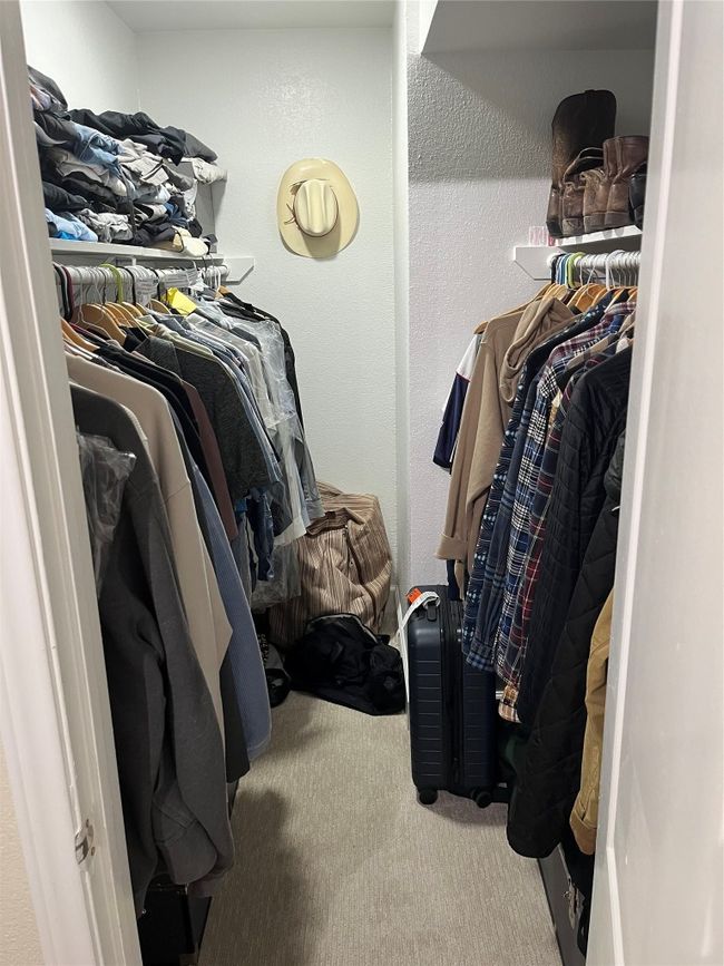 Spacious closet with carpet flooring | Image 10