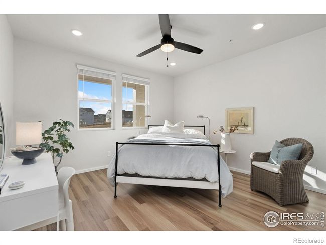 Lovely Primary bedroom features LVP flooring, ceiling fan | Image 13