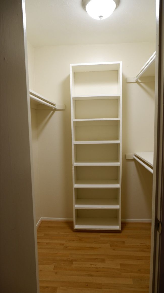 Spacious closet featuring light hardwood / wood-style flooring | Image 18