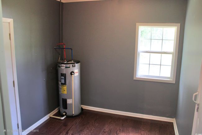 Utilities featuring electric water heater | Image 6