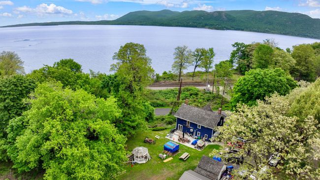 Aerial view of property and surrounding area featuring a water and mountain view | Image 7