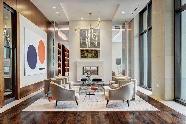 The serene common areas are tastefully appointed with modern furniture and unique contemporary lighting and art. | Image 27